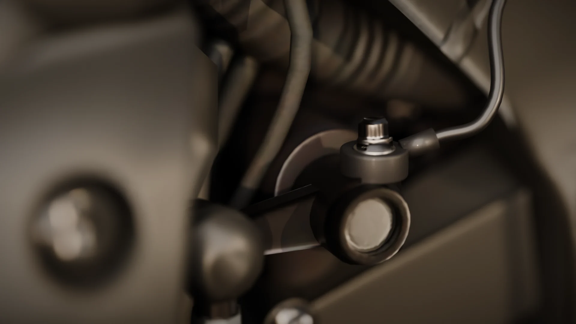 Sensor piezoelétrico do SkidShifter, em forma de arruela, preso no parafuso do braço do câmbio de uma Yamaha R1